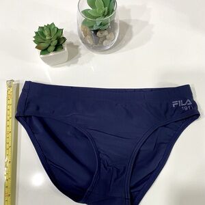 FILA swim brief boys size. See pic for size info.NWOT. Color dark blues.